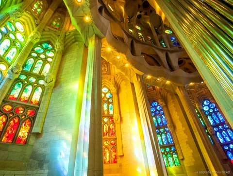 Self-guided visitor exploring the Sagrada Familia with an audio guide
